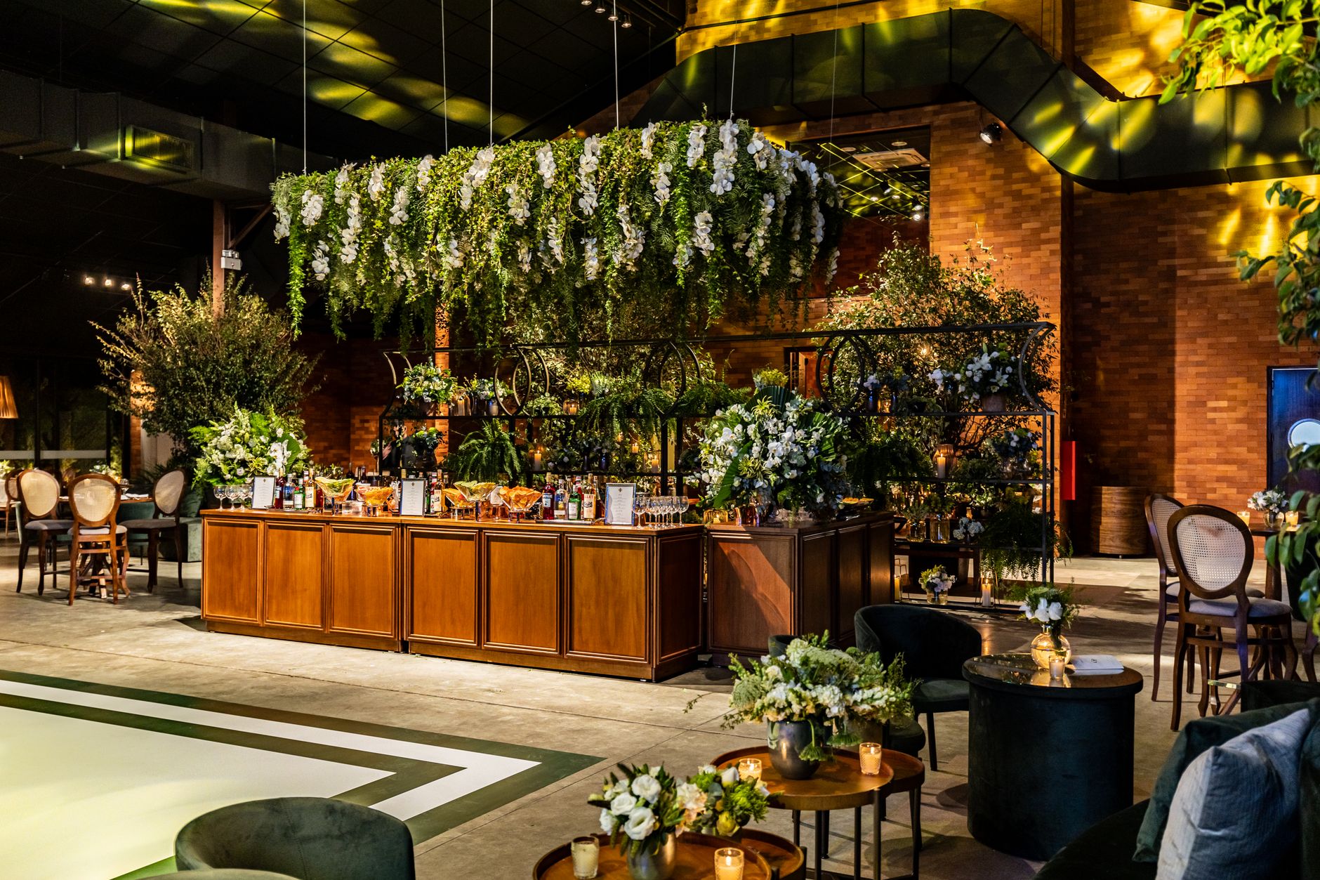 Luxurious indoor event venue with elegant floral decorations and warm lighting. — What to Know Before You Build in Conroe